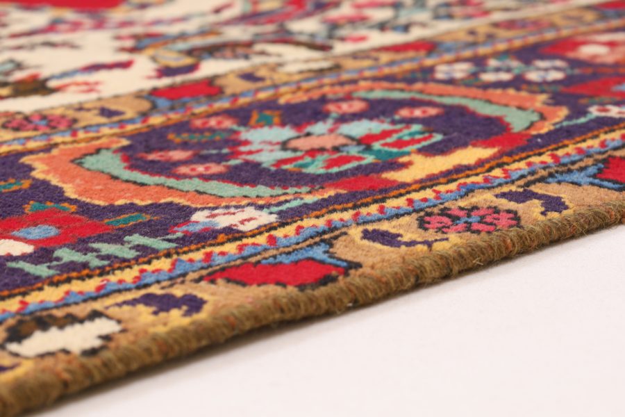 Hand-knotted Persian Mashad carpet