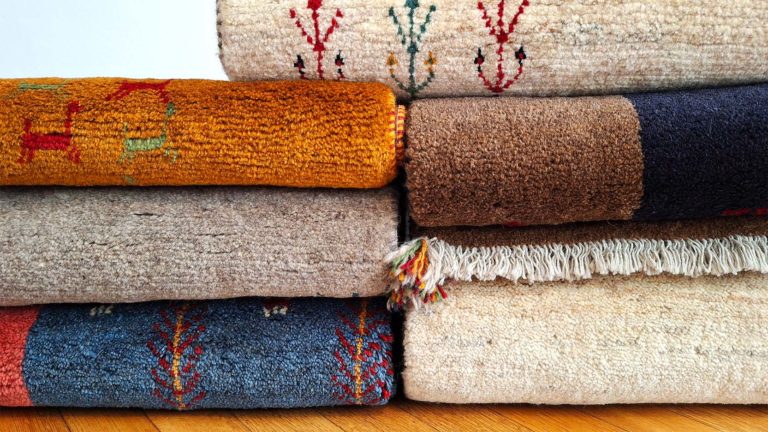 Colourful Gabbeh stack in beige orange blue brown